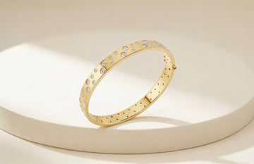 Gold bracelet with embedded stones 