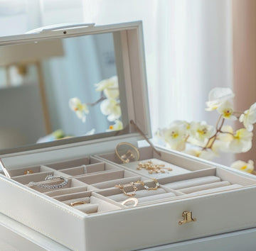 Open jewelry box with various pieces of jewelry 