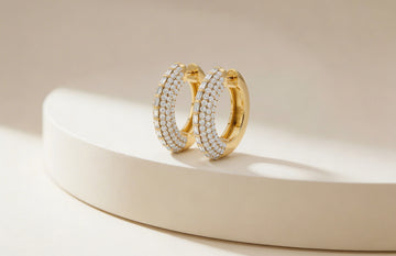 Gold hoop earrings with embedded diamonds 