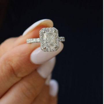 Diamond ring held in a hand 